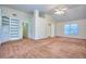 Main bedroom with built-in shelves and carpet at 6764 Blantyre Blvd, Stone Mountain, GA 30087