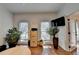 Bright home office features hardwood floors, large windows, and built-in shelving at 3090 Pillement Pl, Alpharetta, GA 30022