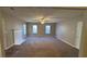 Spacious living room with neutral carpeting and fireplace at 4225 Ward Bluff Dr, Ellenwood, GA 30294