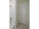 White tiled bathroom with hexagon floor at 5450 Crow Dr, Cumming, GA 30041