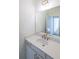 Vanity with quartz countertop and updated fixtures at 5450 Crow Dr, Cumming, GA 30041