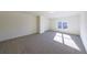 Spacious bedroom with grey carpet and window at 5450 Crow Dr, Cumming, GA 30041