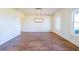Formal dining room with hardwood floors, wainscoting, and a chandelier at 5450 Crow Dr, Cumming, GA 30041