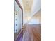 Bright entryway with hardwood floors, high ceilings, and a view to the staircase and living areas at 5450 Crow Dr, Cumming, GA 30041