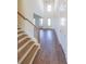 Bright entryway with hardwood floors and staircase at 5450 Crow Dr, Cumming, GA 30041