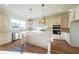 Modern kitchen features a large island, white cabinets, and high-end appliances at 5450 Crow Dr, Cumming, GA 30041