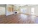 Spacious living area with hardwood floors, fireplace and access to backyard at 5450 Crow Dr, Cumming, GA 30041