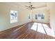Spacious main bedroom with hardwood floors and abundant natural light at 5450 Crow Dr, Cumming, GA 30041