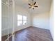 Bright home office with hardwood floors, a ceiling fan, and a window with a view at 5450 Crow Dr, Cumming, GA 30041