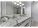 Bathroom boasts marble vanity and a large mirror at 1820 Peachtree Nw St # 1005, Atlanta, GA 30309