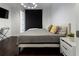 Spacious bedroom with king bed and dark hardwood floors at 1820 Peachtree Nw St # 1005, Atlanta, GA 30309