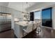Modern kitchen with island, stainless steel appliances, and white cabinets at 1820 Peachtree Nw St # 1005, Atlanta, GA 30309