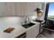 Modern kitchen with sleek cabinetry and gas range at 1820 Peachtree Nw St # 1005, Atlanta, GA 30309