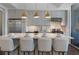 Modern kitchen with island, stainless steel appliances, and white cabinets at 1820 Peachtree Nw St # 1005, Atlanta, GA 30309