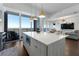 Modern kitchen with island, stainless steel appliances, and city views at 1820 Peachtree Nw St # 1005, Atlanta, GA 30309