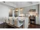 Modern kitchen with island, stainless steel appliances, and white cabinets at 1820 Peachtree Nw St # 1005, Atlanta, GA 30309
