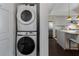 Convenient laundry closet with a stacked washer and dryer at 1820 Peachtree Nw St # 1005, Atlanta, GA 30309