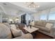 Open living room with hardwood floors and kitchen view at 1820 Peachtree Nw St # 1005, Atlanta, GA 30309