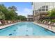 Resort-style pool with plenty of lounge chairs at 1820 Peachtree Nw St # 1005, Atlanta, GA 30309