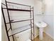 Simple bathroom with pedestal sink and toilet at 464 Maxwell Rd, Roswell, GA 30075