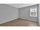 Simple bedroom with light grey walls and wood-look flooring at 5697 Meadowood Dr, Acworth, GA 30102