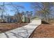 Ranch home with a driveway and mature trees at 5697 Meadowood Dr, Acworth, GA 30102