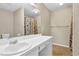 Clean bathroom with shower/tub combo and white vanity at 1039 Megan Ct, Sugar Hill, GA 30518