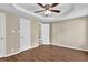 Spacious bedroom with wood-look floors and ceiling fan at 1039 Megan Ct, Sugar Hill, GA 30518