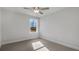 Neutral-walled bedroom with carpet, a window, and a ceiling fan at 124 Aj Welch Jr Way, Mcdonough, GA 30252