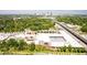 Spacious aerial view of commercial buildings, mature trees, and Atlanta skyline in the distance at 110 Bowen Sw Cir, Atlanta, GA 30315