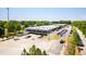 Wide aerial view of mixed-use space with storefronts and large parking lot at 110 Bowen Sw Cir, Atlanta, GA 30315