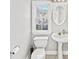 Bathroom with single sink vanity, toilet, framed mirror, and shower-tub combo at 110 Bowen Sw Cir, Atlanta, GA 30315