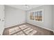 Bright bedroom with neutral paint, carpet, and a view from the window at 110 Bowen Sw Cir, Atlanta, GA 30315