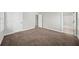 Carpeted bedroom featuring natural light from the window and access to the bathroom at 110 Bowen Sw Cir, Atlanta, GA 30315