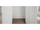 Walk-in closet with white wire shelving and carpeted flooring at 110 Bowen Sw Cir, Atlanta, GA 30315