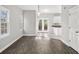 View of the dining room with natural light, wood floors, and french doors to the deck at 110 Bowen Sw Cir, Atlanta, GA 30315