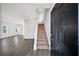 Open entryway with hardwood floors, staircase, and view into the spacious living area at 110 Bowen Sw Cir, Atlanta, GA 30315