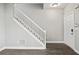 Open entryway featuring hardwood floors, staircase, and a front door at 110 Bowen Sw Cir, Atlanta, GA 30315