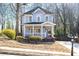 Attractive two-story home with a welcoming porch and well-kept landscaping at 110 Bowen Sw Cir, Atlanta, GA 30315