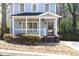Charming home with a covered porch, brick accents, and neat landscaping at 110 Bowen Sw Cir, Atlanta, GA 30315