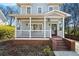 Charming home with a covered porch, brick accents, and a welcoming entryway at 110 Bowen Sw Cir, Atlanta, GA 30315
