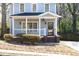 Charming home featuring a welcoming front porch with swing and neat front yard at 110 Bowen Sw Cir, Atlanta, GA 30315