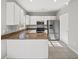 Clean kitchen with white cabinets, stainless steel appliances, and granite countertops at 110 Bowen Sw Cir, Atlanta, GA 30315