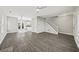 Spacious living room with wood-look floors and an open layout to the kitchen at 110 Bowen Sw Cir, Atlanta, GA 30315