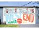 Another West End ATL mural featuring vintage Coca-Cola bottles and neighborhood houses at 110 Bowen Sw Cir, Atlanta, GA 30315