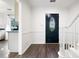 Dark hardwood floors, white walls and a view into the kitchen at 1229 Whitlock Ridge Sw Dr, Marietta, GA 30064