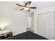 Simple bedroom with double doors and a nightstand at 3980 Carlton Cove Ct, Loganville, GA 30052