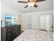 Primary bedroom with large dresser and en-suite bathroom at 3980 Carlton Cove Ct, Loganville, GA 30052