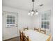 Charming dining room with tile-top table and access to backyard at 3980 Carlton Cove Ct, Loganville, GA 30052