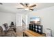 Bright living room features hardwood floors, ceiling fan and comfy seating at 3980 Carlton Cove Ct, Loganville, GA 30052